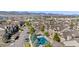 Beautiful aerial view of condos with a swimming pool and mountain views in the background at 9390 W Chatfield Pl # 108, Littleton, CO 80128