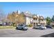 Attractive multi-story condo building with well-kept landscaping and ample parking at 9390 W Chatfield Pl # 108, Littleton, CO 80128