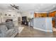 Open-concept living area with modern finishes, fireplace, and seamless flow to the kitchen at 9390 W Chatfield Pl # 108, Littleton, CO 80128