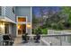 Exterior view of a well-maintained backyard featuring a dining table and outdoor grill at 8940 W 80Th Dr, Arvada, CO 80005