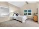 Cozy bedroom with vaulted ceilings, neutral tones, and ample natural light from multiple windows at 8940 W 80Th Dr, Arvada, CO 80005