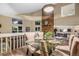 Bright dining space with a modern glass table, comfortable seating, and plenty of natural light at 8940 W 80Th Dr, Arvada, CO 80005