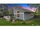 Two-story home featuring a well-maintained lawn, mature trees, and a deck perfect for outdoor enjoyment at 8940 W 80Th Dr, Arvada, CO 80005