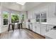 Bright eat-in kitchen features natural light, stainless steel appliances, and quartz countertops at 8940 W 80Th Dr, Arvada, CO 80005