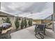 Back patio featuring elegant outdoor dining set, perfect for entertaining with scenic views at 5775 Pinto Valley St, Parker, CO 80134
