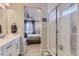 Bathroom view to main bedroom with a glass enclosed shower and tile flooring at 5775 Pinto Valley St, Parker, CO 80134