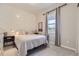 Comfortable bedroom with stylish shiplap accent wall and modern decor at 5775 Pinto Valley St, Parker, CO 80134