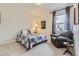 Cozy bedroom with a plush armchair, natural light, and comfortable decor at 5775 Pinto Valley St, Parker, CO 80134