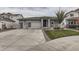 Charming home featuring a three-car garage, stone accents, and well-manicured front yard at 5775 Pinto Valley St, Parker, CO 80134
