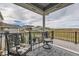 Covered patio featuring comfortable seating, offering an ideal spot to enjoy the open landscape views at 5775 Pinto Valley St, Parker, CO 80134