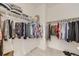 Organized walk-in closet providing ample storage space for clothing and accessories at 5775 Pinto Valley St, Parker, CO 80134
