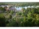 Scenic aerial view overlooking a lake and green spaces filled with people enjoying the outdoors at 1434 Clermont St, Denver, CO 80220