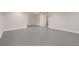 Open basement area showcasing clean gray tile floors and white trim throughout at 1434 Clermont St, Denver, CO 80220