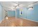 Bright bedroom with hardwood floors, mirrored closet doors, and a large window at 1434 Clermont St, Denver, CO 80220