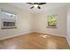 Empty bedroom with hardwood floors, base molding, and natural light at 1434 Clermont St, Denver, CO 80220