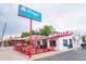 A brightly colored ice cream shop with outdoor seating and a retro sign offers a welcoming and fun atmosphere at 1434 Clermont St, Denver, CO 80220