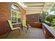 Cozy front porch with comfortable seating and brick details for relaxing outdoors at 1434 Clermont St, Denver, CO 80220
