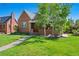 Charming brick home with a well-manicured lawn and mature trees in a desirable neighborhood at 1434 Clermont St, Denver, CO 80220