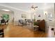 Spacious living room with hardwood floors and open layout to adjacent dining area at 1434 Clermont St, Denver, CO 80220
