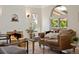 Comfortable living room featuring a cozy fireplace and light-filled windows at 1434 Clermont St, Denver, CO 80220