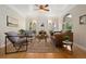 Bright living room featuring a decorative fireplace, hardwood floors and stylish furnishings at 1434 Clermont St, Denver, CO 80220