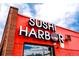 Close-up of Sushi Harbor's exterior, highlighting the building's facade and prominent signage at 1434 Clermont St, Denver, CO 80220
