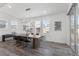 Dining room with a modern table, chairs, chandelier, and large windows at 14593 Tango Loop, Parker, CO 80134