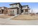 Charming two-story home with stone accents and a welcoming front porch at 14593 Tango Loop, Parker, CO 80134