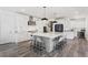 Modern kitchen featuring a large center island and stainless steel appliances at 14593 Tango Loop, Parker, CO 80134