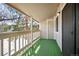View of the covered balcony with an artificial turf surface perfect for relaxing outdoors at 8225 Fairmount Dr # 10-204, Denver, CO 80247