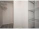 Walk-in closet includes wire shelving for easy organization and ample storage space at 8225 Fairmount Dr # 10-204, Denver, CO 80247