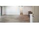 Bright living space with wood flooring and a view into the dining area and kitchen at 8225 Fairmount Dr # 10-204, Denver, CO 80247