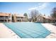 Community pool covered and ready for the off-season with building exteriors in the background at 8225 Fairmount Dr # 10-204, Denver, CO 80247