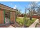 Large backyard with mature trees and plenty of space for outdoor activities at 65 Reed St, Lakewood, CO 80226