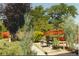 Backyard features a lawn, gravel area, and garden furniture at 65 Reed St, Lakewood, CO 80226