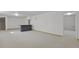 Expansive finished basement with a stylish bar, offering versatile space for entertaining and relaxing at 65 Reed St, Lakewood, CO 80226