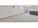 Fully finished basement with a functional bar setup, ready for entertainment and relaxation at 65 Reed St, Lakewood, CO 80226