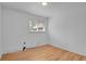 Well-lit bedroom offers a cozy space with hardwood floors and a window for natural light at 65 Reed St, Lakewood, CO 80226
