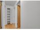 Hallway view with closet storage at 65 Reed St, Lakewood, CO 80226