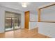 An open concept living room boasts hardwood floors and bright natural light at 65 Reed St, Lakewood, CO 80226
