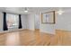 Inviting living space featuring hardwood floors, large windows, and open layout at 65 Reed St, Lakewood, CO 80226