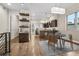 Open dining area with modern table, hardwood floors, and seamless flow to the kitchen at 175 W 10Th Ave, Denver, CO 80204