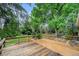 Spacious back deck surrounded by lush landscaping, creating a tranquil outdoor living space at 5190 W Mexico Ave, Denver, CO 80219
