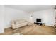 Cozy living room with neutral tones, comfortable sofa, and a TV set at 5190 W Mexico Ave, Denver, CO 80219