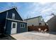 Backyard features a quaint patio area with chairs and a low maintenance yard at 2831 N Perry St, Denver, CO 80212