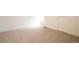 Bright bedroom features neutral carpet, white trim, and an abundance of natural light at 2831 N Perry St, Denver, CO 80212