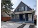 Charming two-story home with modern curb appeal, crisp white trim, and professionally landscaped front yard at 2831 N Perry St, Denver, CO 80212