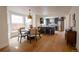 Open concept kitchen and dining area with stainless steel appliances and stylish pendant lighting at 2831 N Perry St, Denver, CO 80212