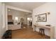 Spacious open floor plan showcases living room with contemporary fireplace and gleaming hardwood floors at 2831 N Perry St, Denver, CO 80212