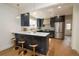 Modern kitchen with dark blue cabinets, white countertops, and stainless steel appliances at 2831 N Perry St St, Denver, CO 80212